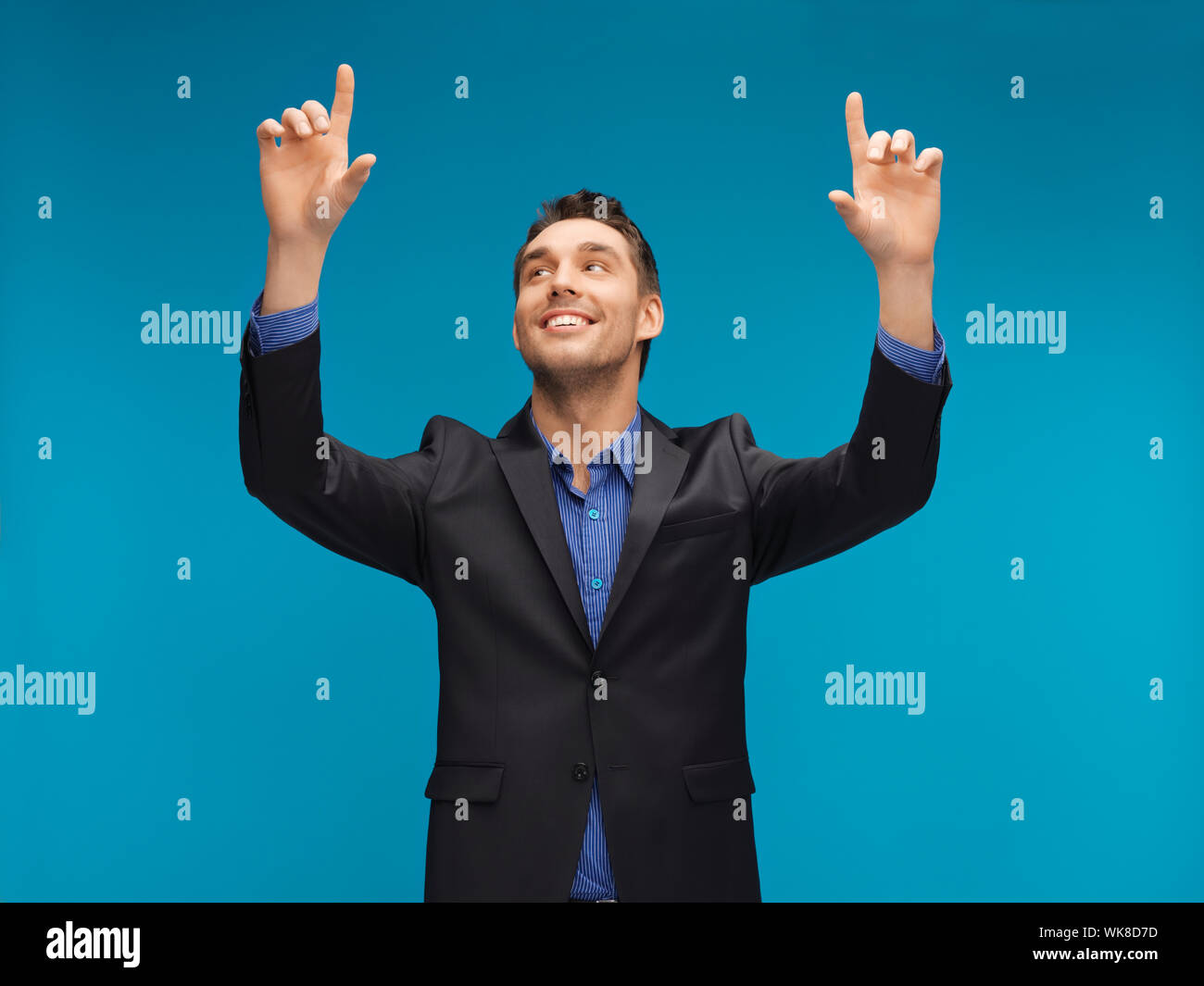 man in suit working with something imaginary Stock Photo