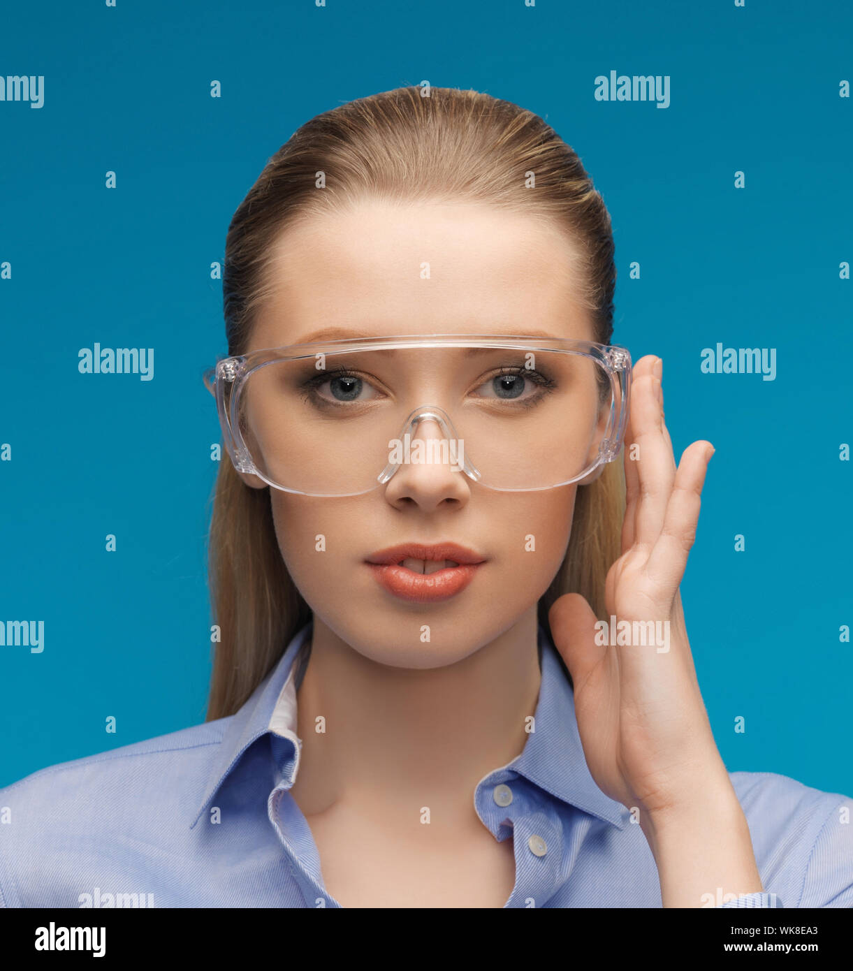 Lady in safety glasses hi-res stock photography and images - Alamy