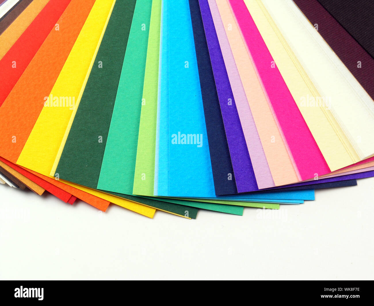 Colored samples of different papers on white background, business cards Stock Photo