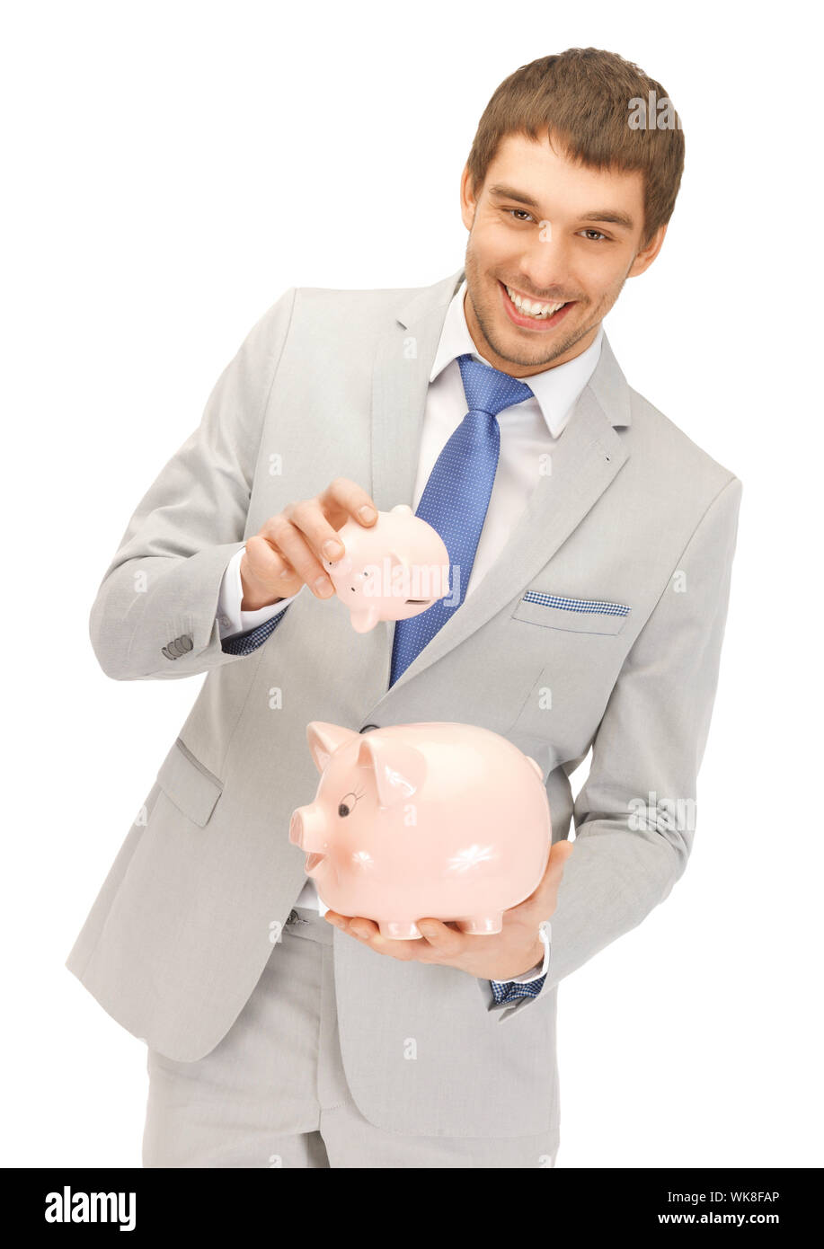 picture of handsome man with two piggy banks Stock Photo - Alamy