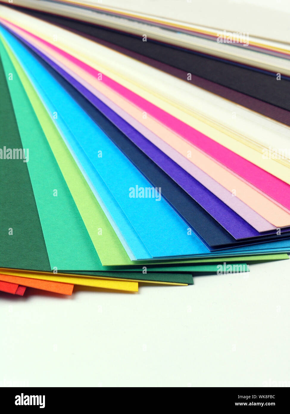 Colored samples of different papers on white background, business cards ...