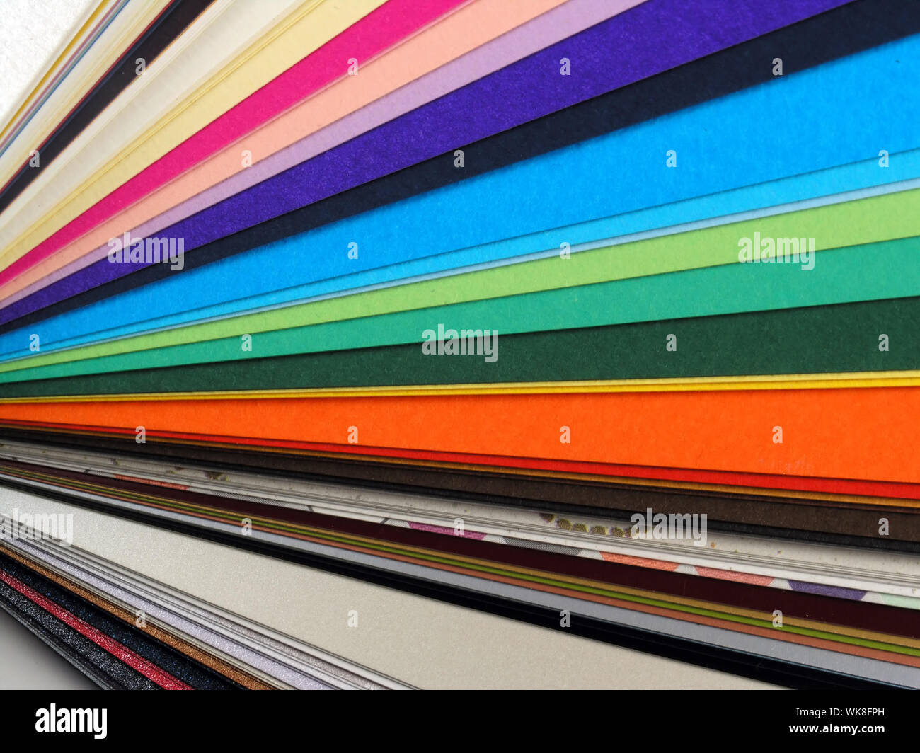 Colored samples of different papers on white background, business cards Stock Photo