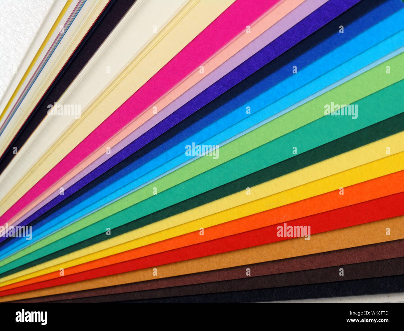 Colored samples of different papers on white background, business cards Stock Photo