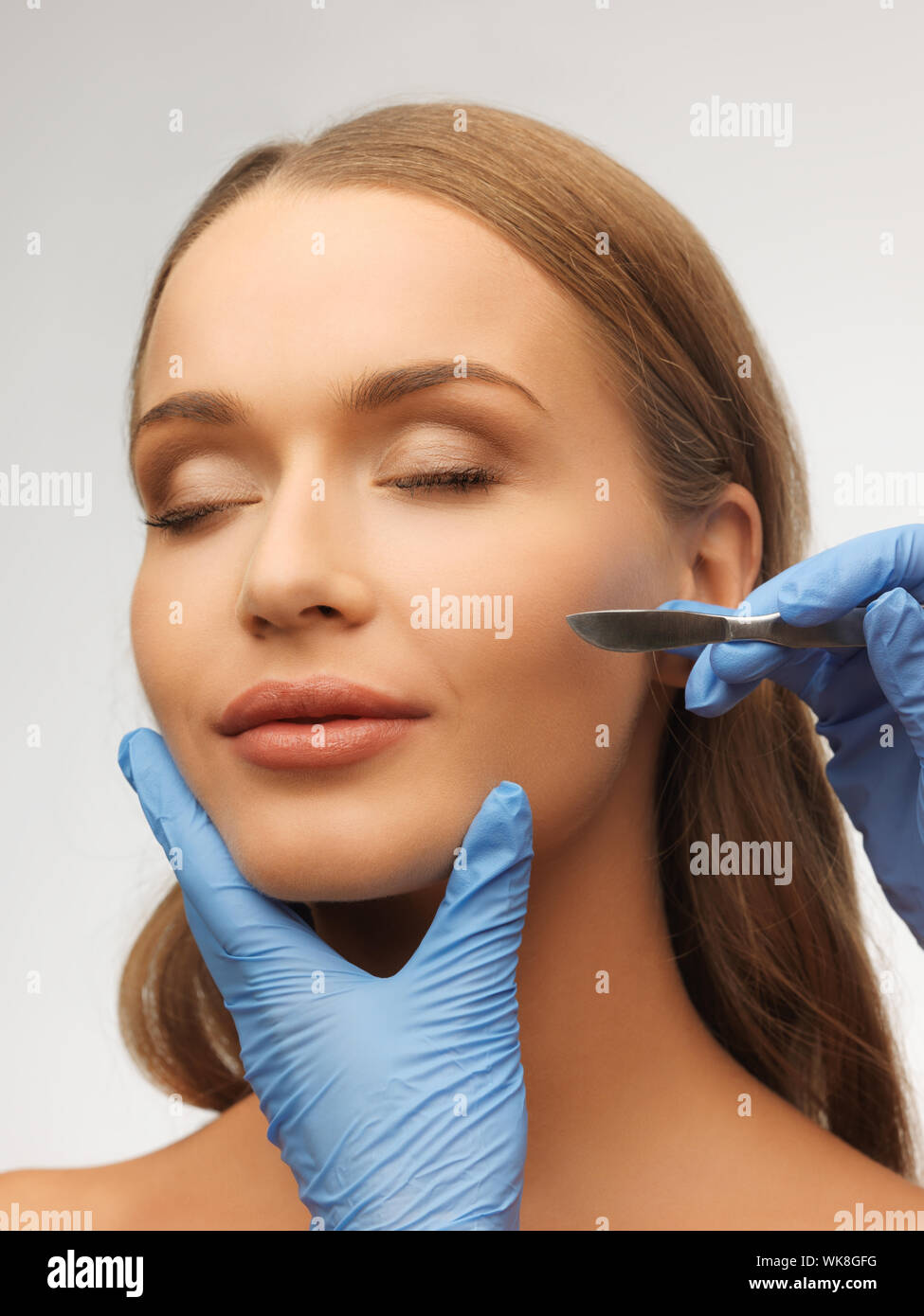 woman face and beautician hands Stock Photo Alamy