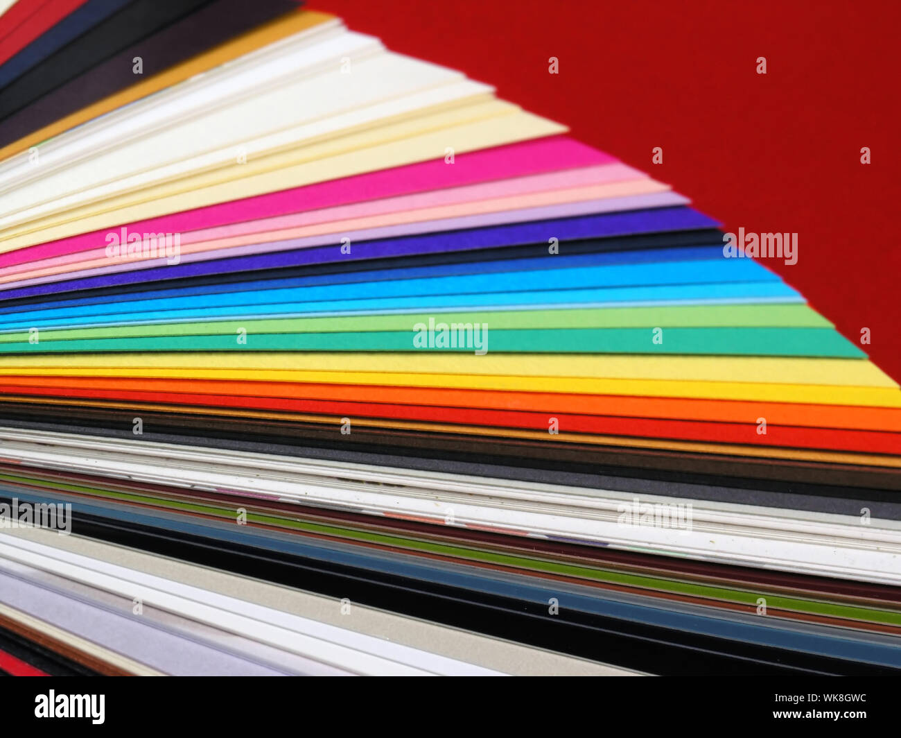 Colored samples of different papers on white background, business cards Stock Photo