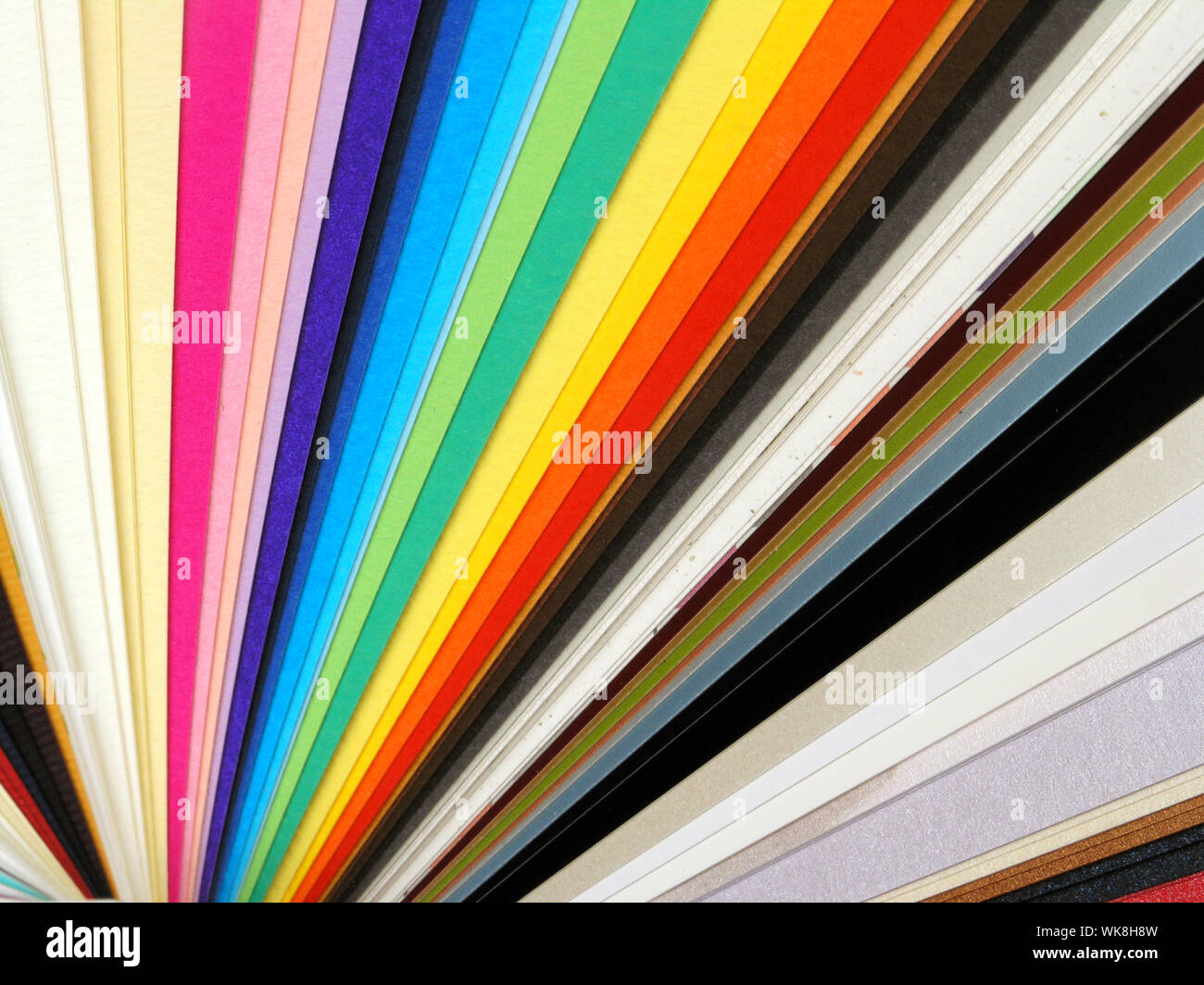 Colored samples of different papers on white background, business cards Stock Photo
