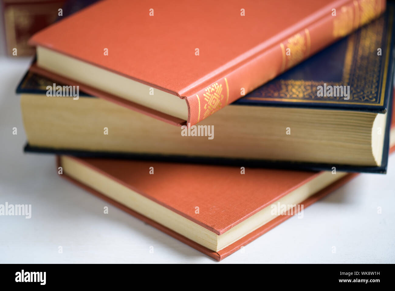A stack of books on the white background, seletive focus, Education and wisdom concept Stock Photo