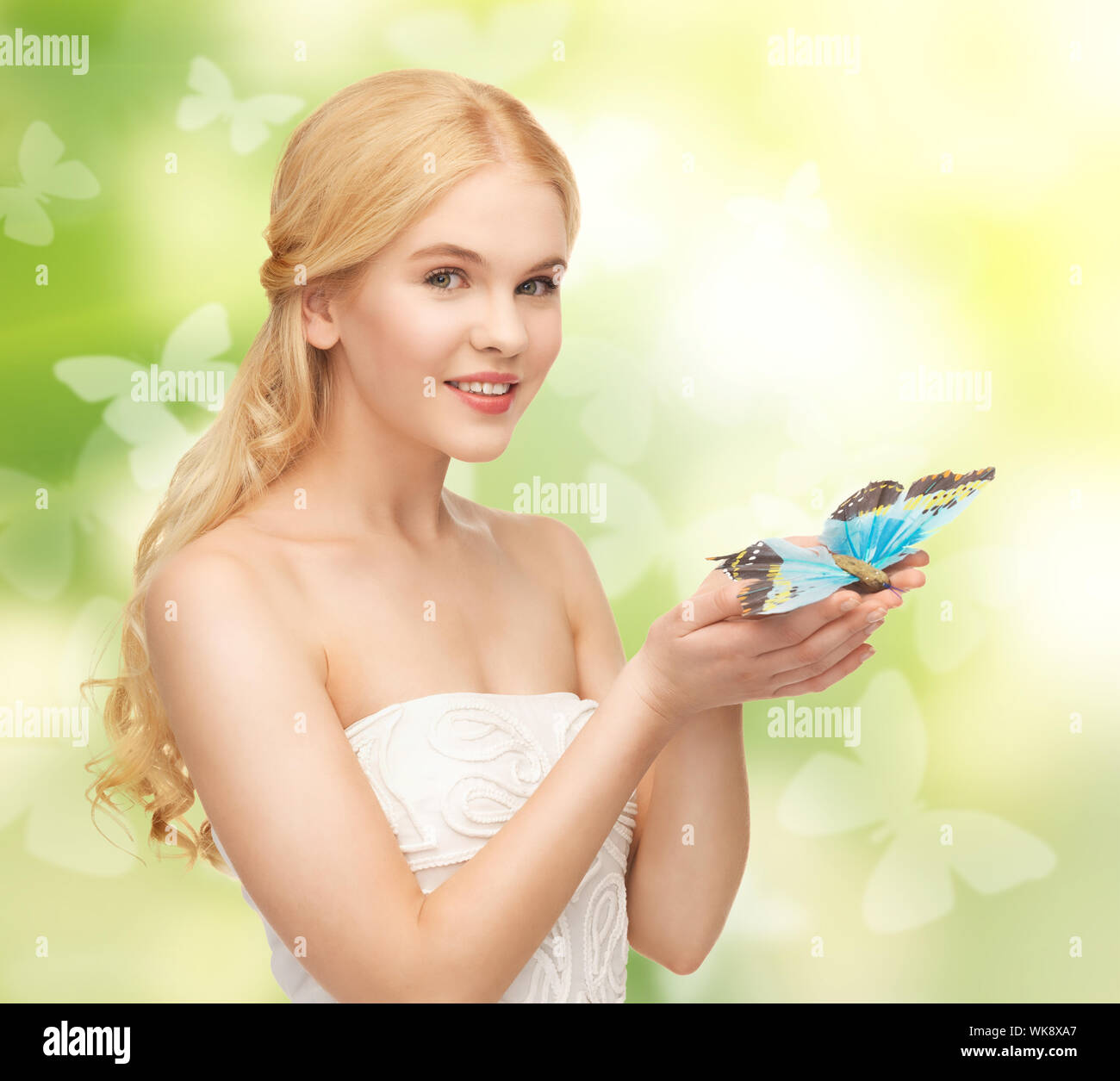 woman with butterfly in hand Stock Photo Alamy