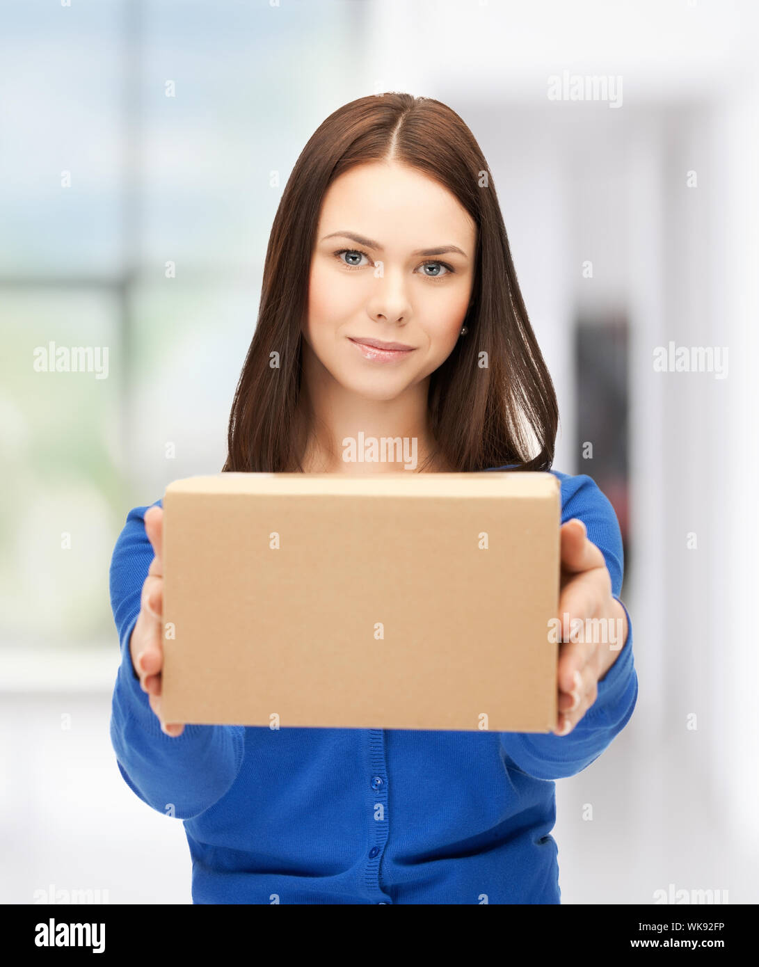 businesswoman delivering box Stock Photo Alamy