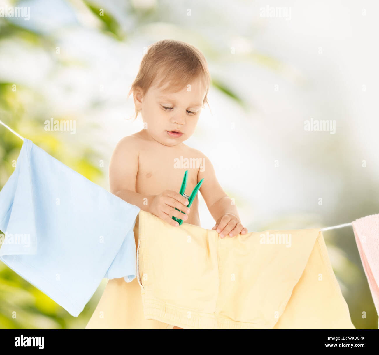 baby doing laundry Stock Photo Alamy