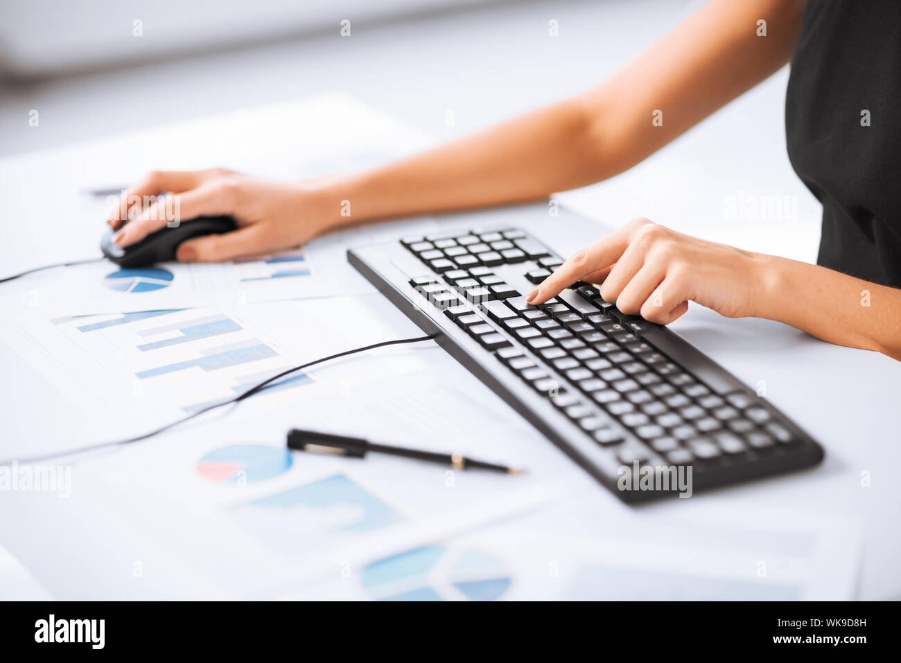 woman hands typing on keyboard Stock Photo