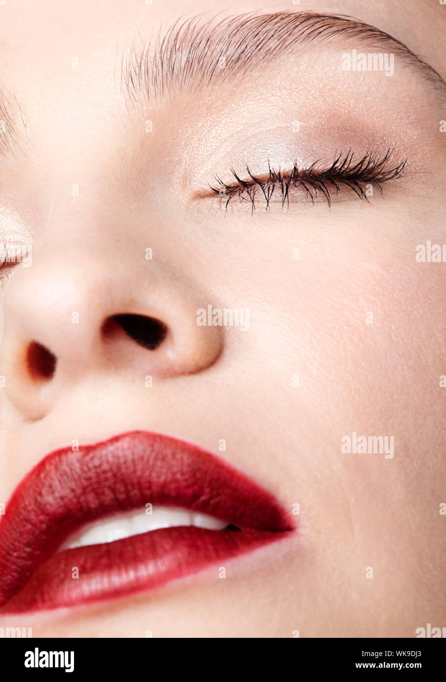 Closeup macro portrait of female part of face. Human woman with red ...