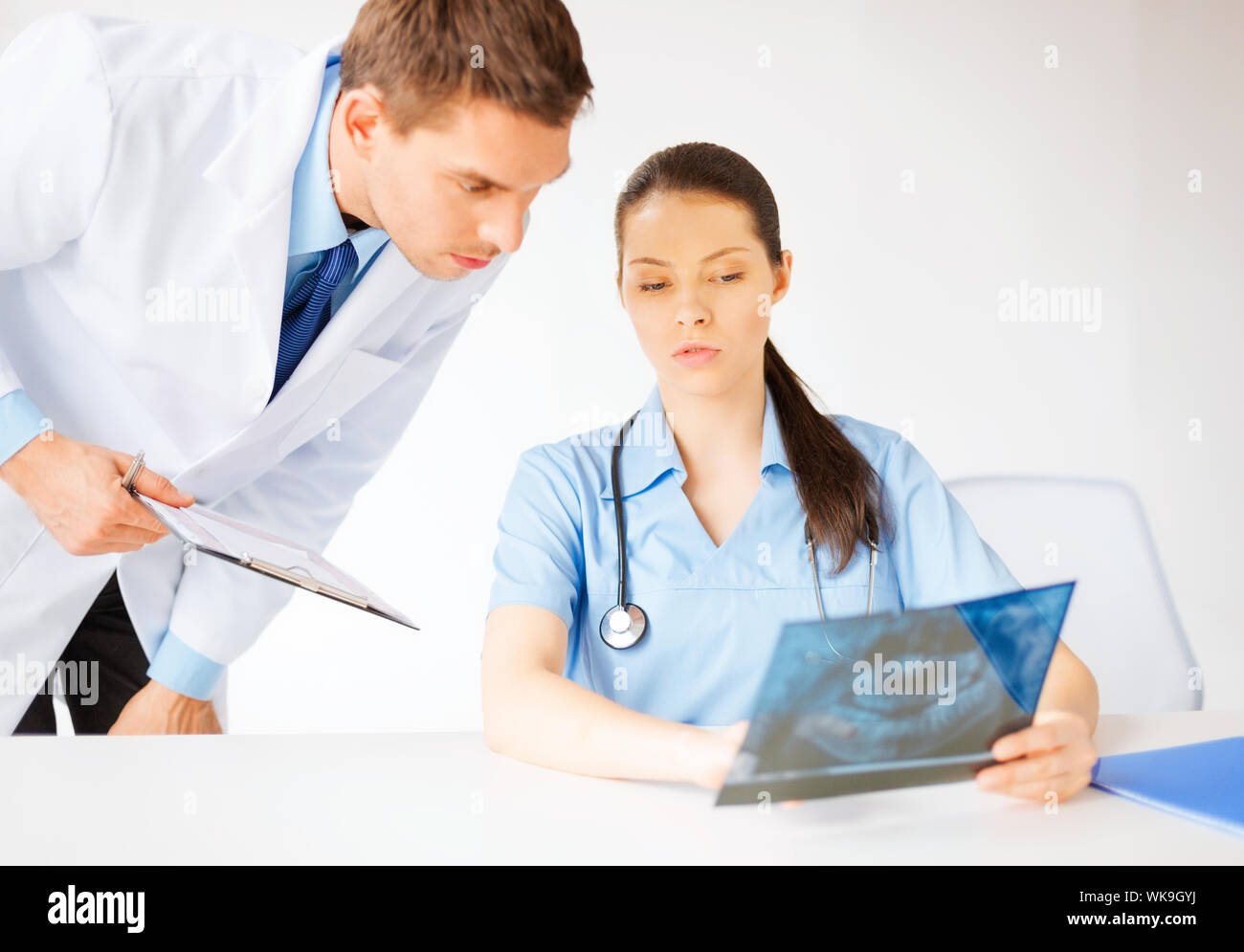 two medical workers looking at x-ray Stock Photo