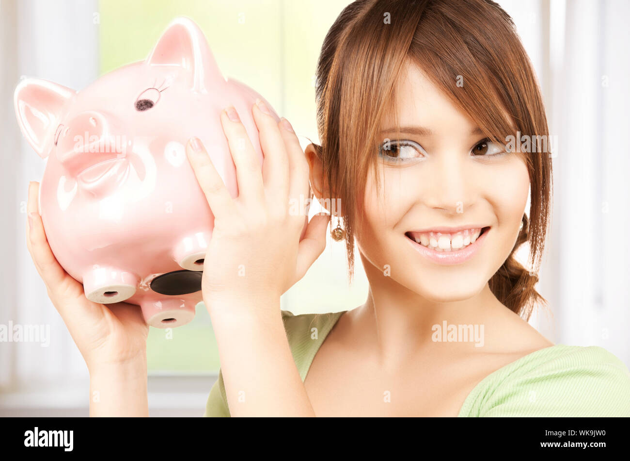 lovely girl with big piggy bank Stock Photo - Alamy
