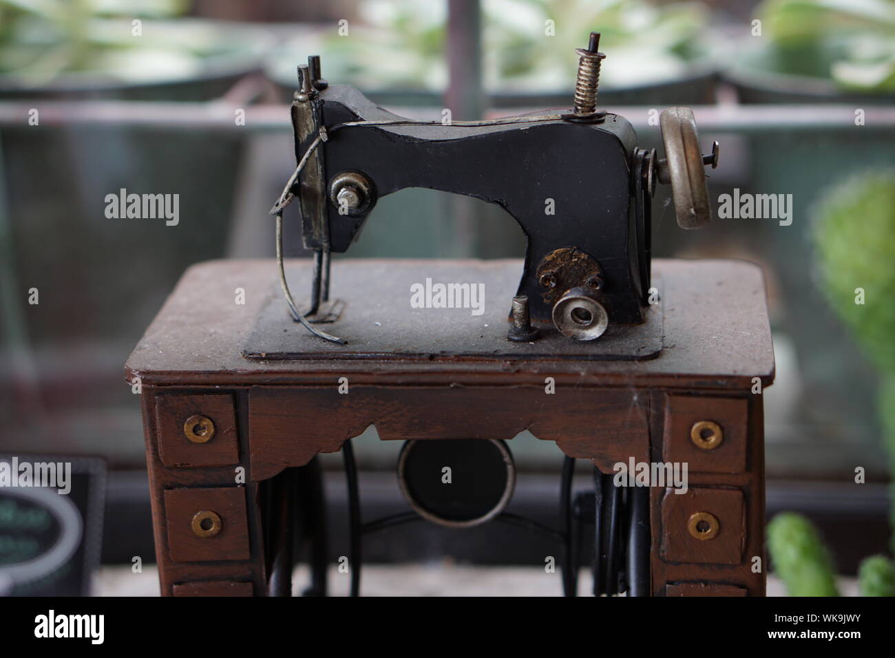 Sewing Machine On Table Stock Photo Alamy