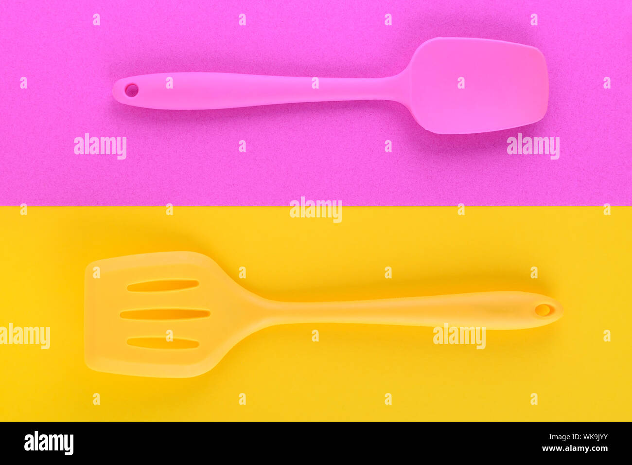Bright Kitchen Utensils On Yellow And Purple Background Creative