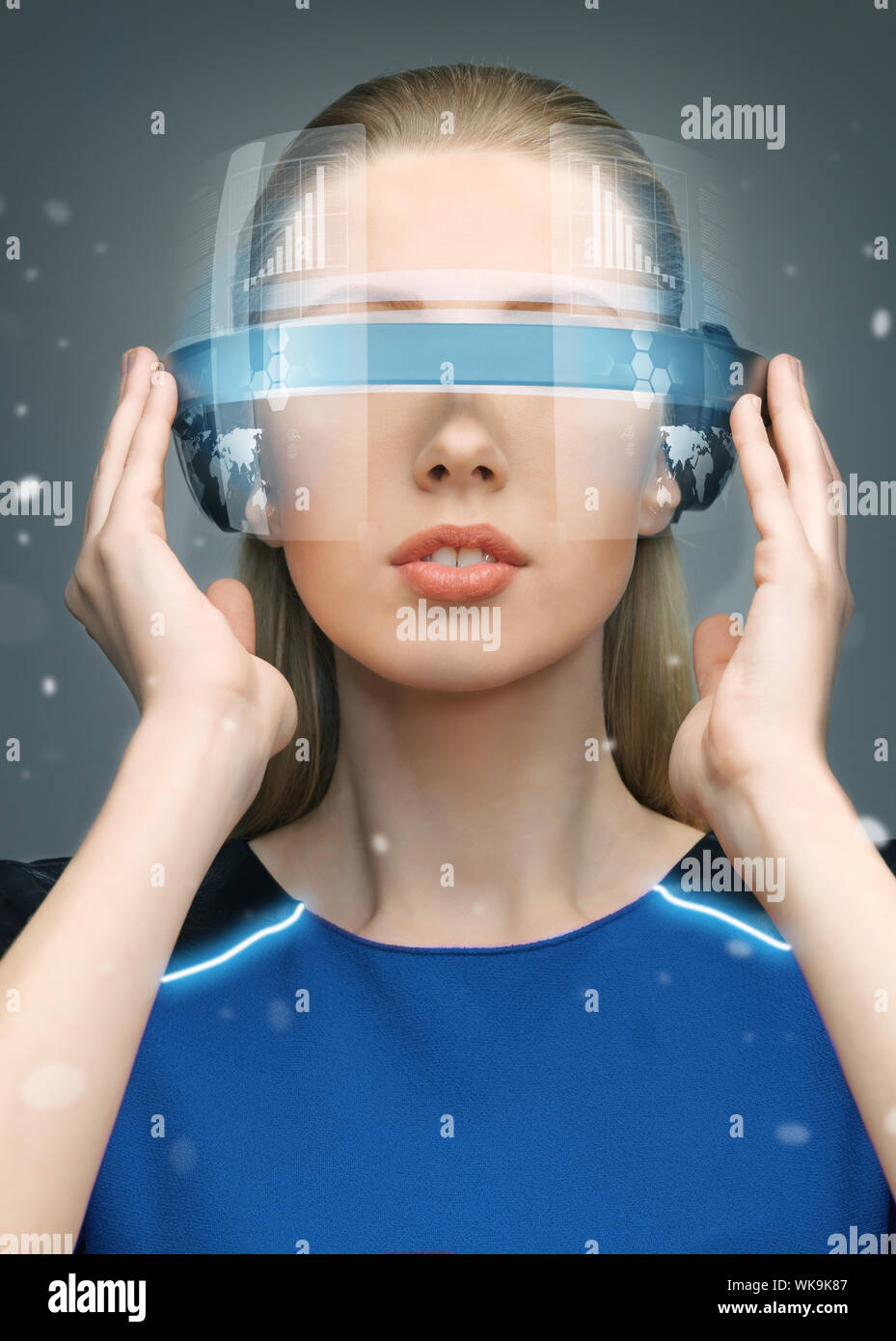 beautiful woman in futuristic glasses and blue dress Stock Photo - Alamy