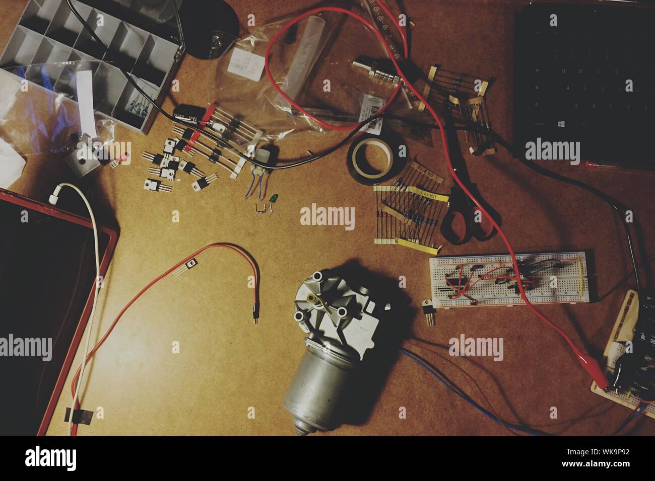 High Angle View Of Machine Part And Wires On Table Stock Photo