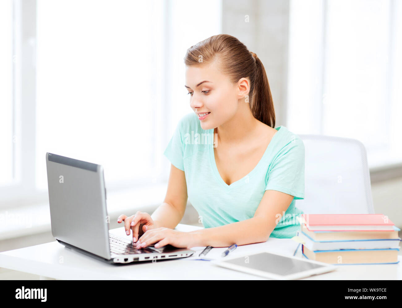smiling student girl with laptop Stock Photo - Alamy