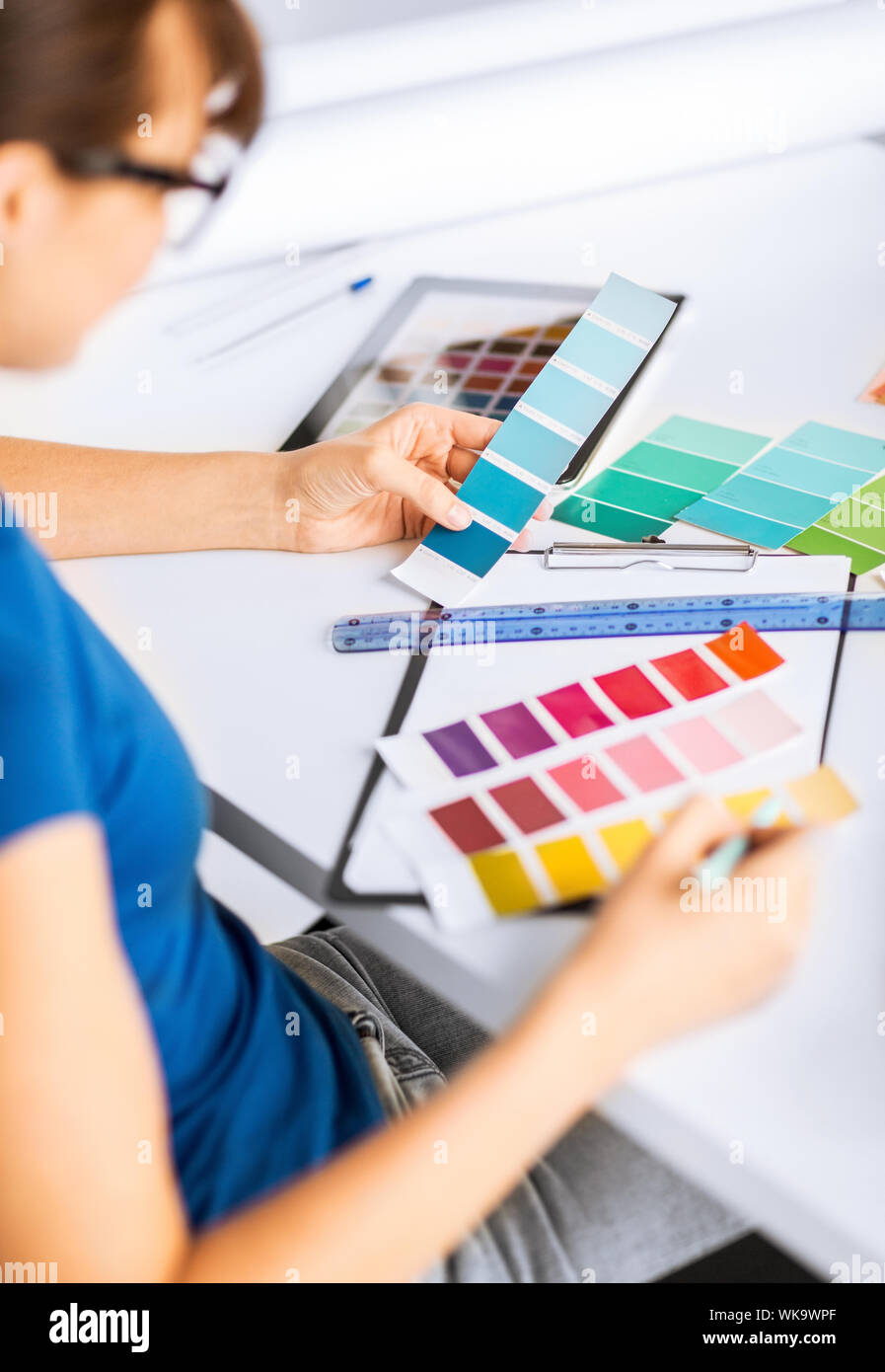 Working With Color interior design and renovation concept - woman working with color ...