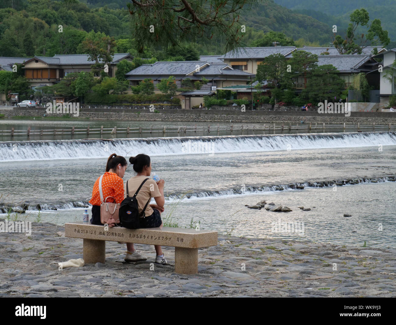 JAPAN - photo by Sean Sprague  Arashiyama, Kyoto. Sightseers beside Hozu-gawa river. Stock Photo