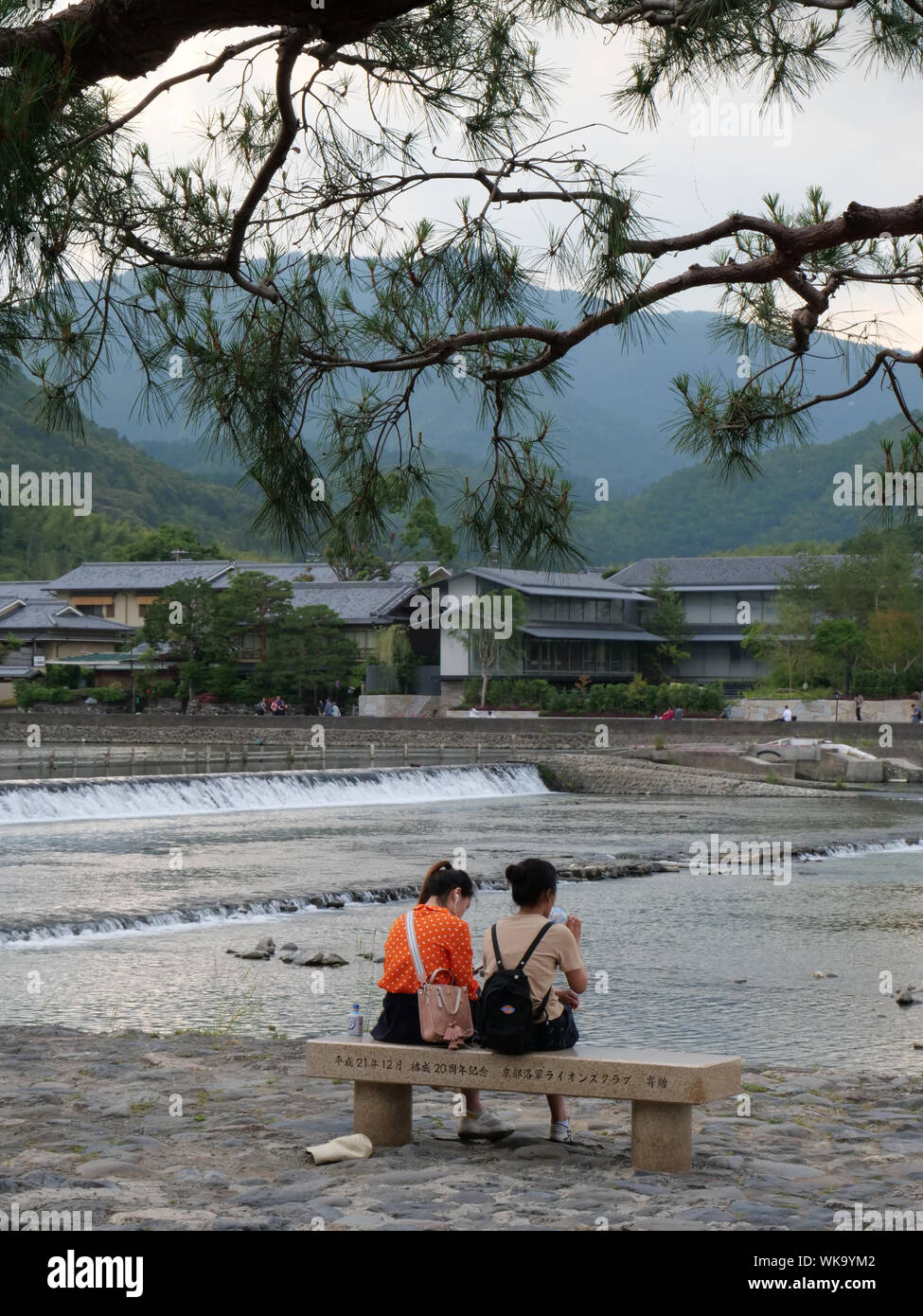 JAPAN - photo by Sean Sprague  Arashiyama, Kyoto. Sightseers beside Hozu-gawa river. Stock Photo