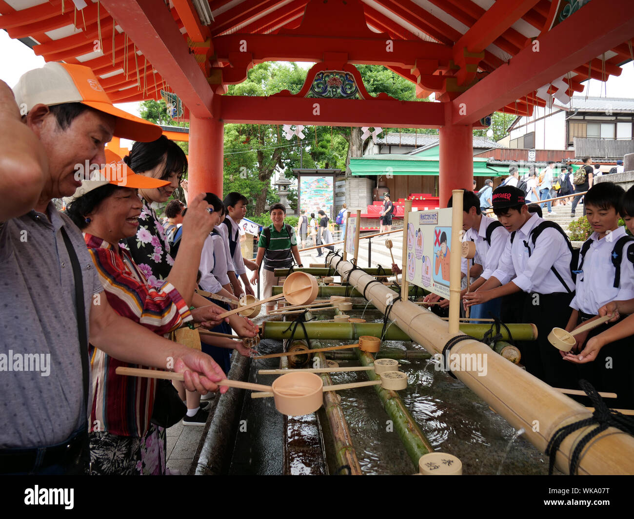 JAPAN - photo by Sean Sprague  Kyoto. Fushimi Inari-Taishi shrine with its vermilion torii (gates). Ritual ablutions at entrance. Stock Photo