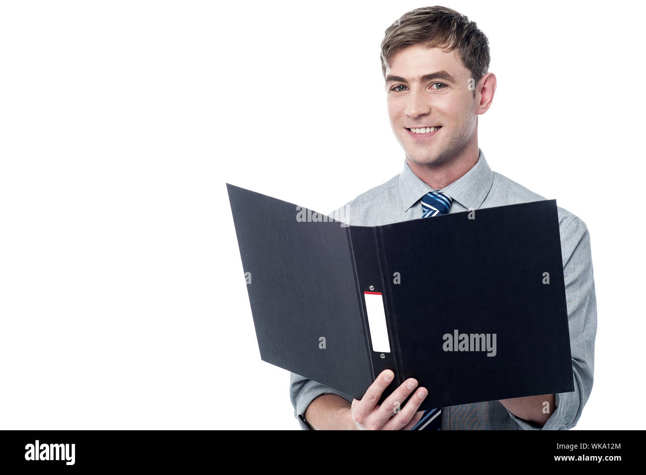 Young businessman reading documents inside a folder Stock Photo