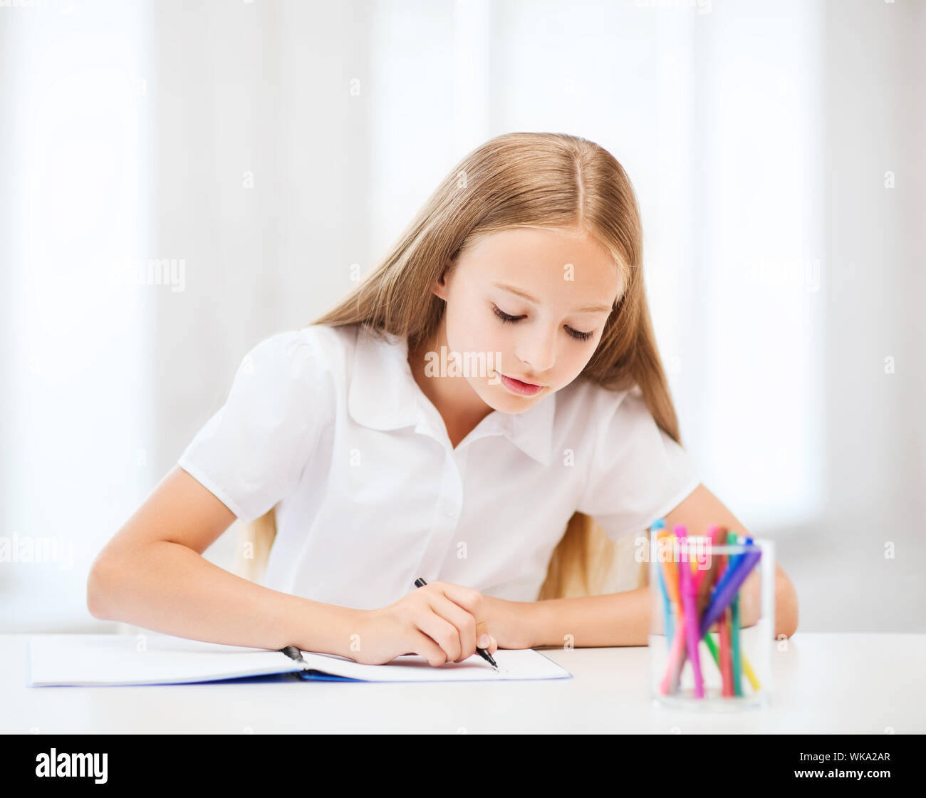 little student girl drawing at school Stock Photo - Alamy