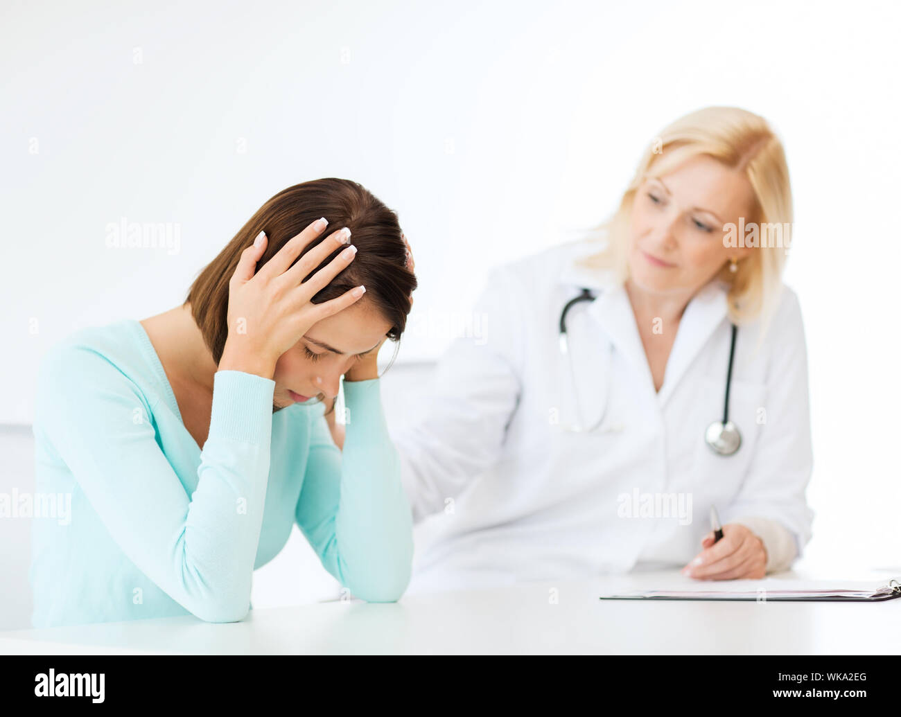 healthcare and medical concept - doctor with patient in hospital Stock Photo