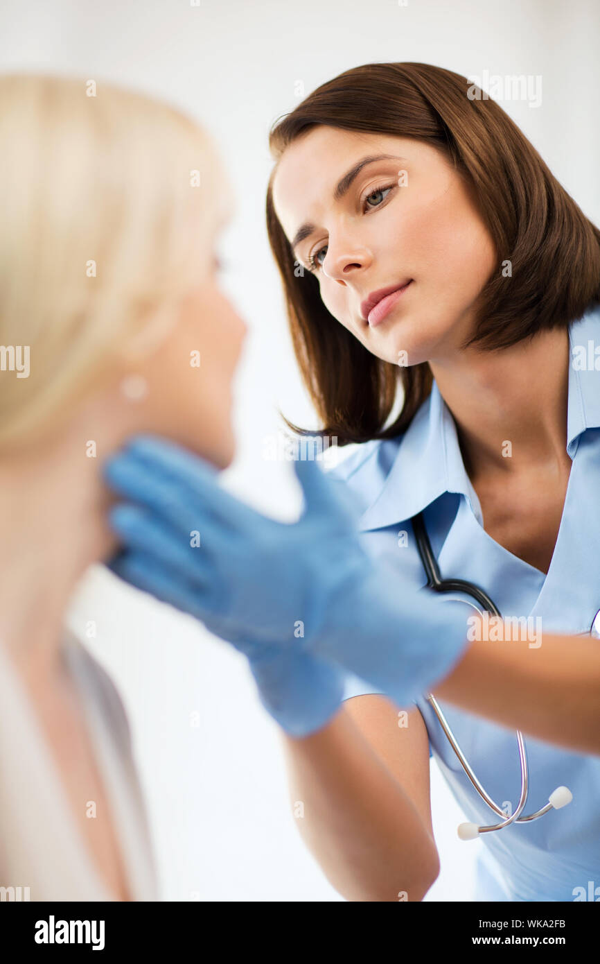 plastic surgeon or doctor with patient Stock Photo Alamy