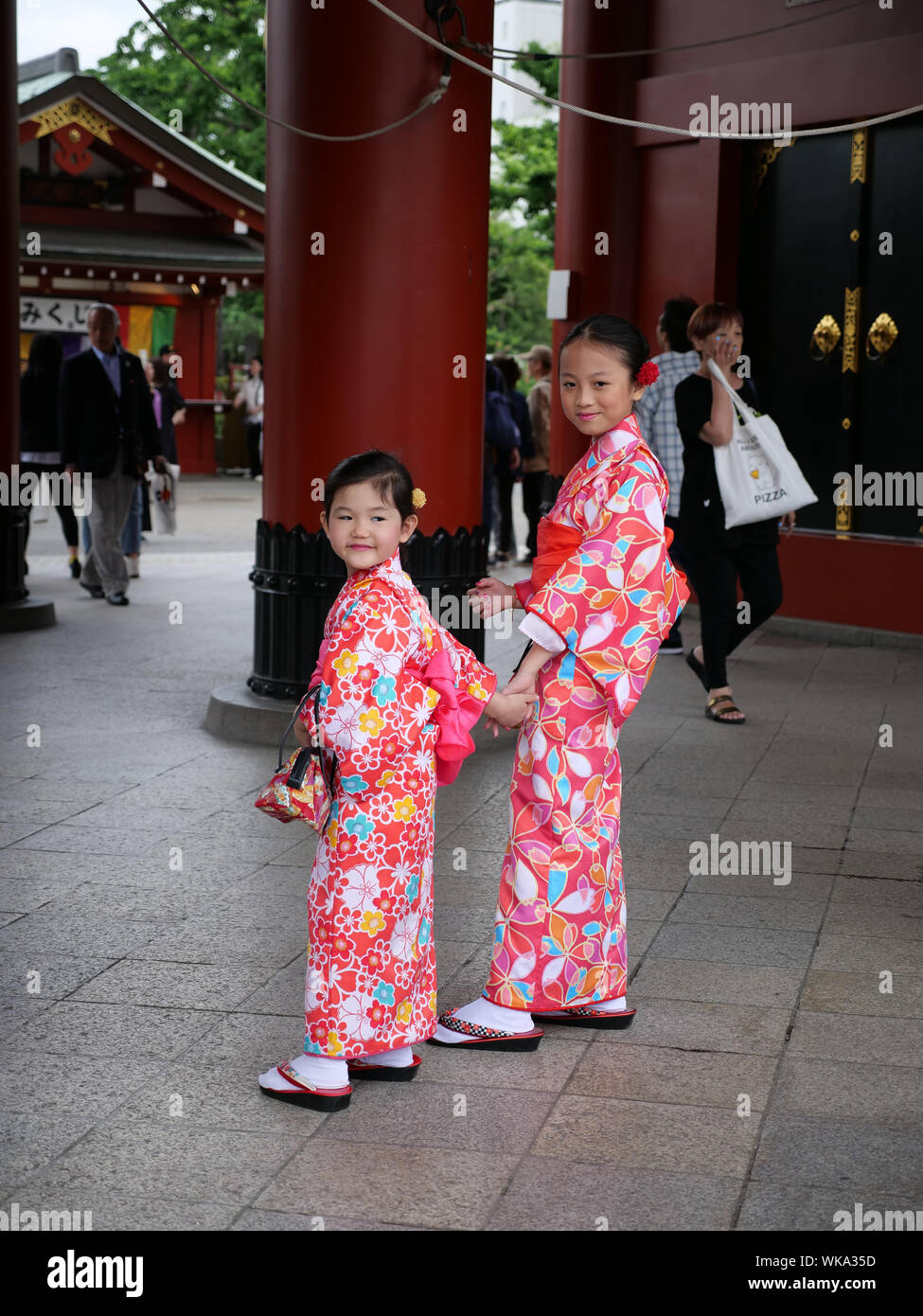 JAPAN - photo by Sean Sprague  Asakusa, Tokyo. Japanese visitors to Senso-ji temple wearing traditional kimono. Stock Photo