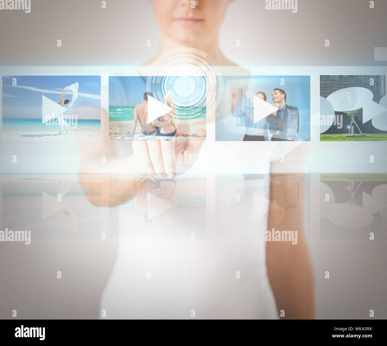 woman pressing button on virtual screen Stock Photo