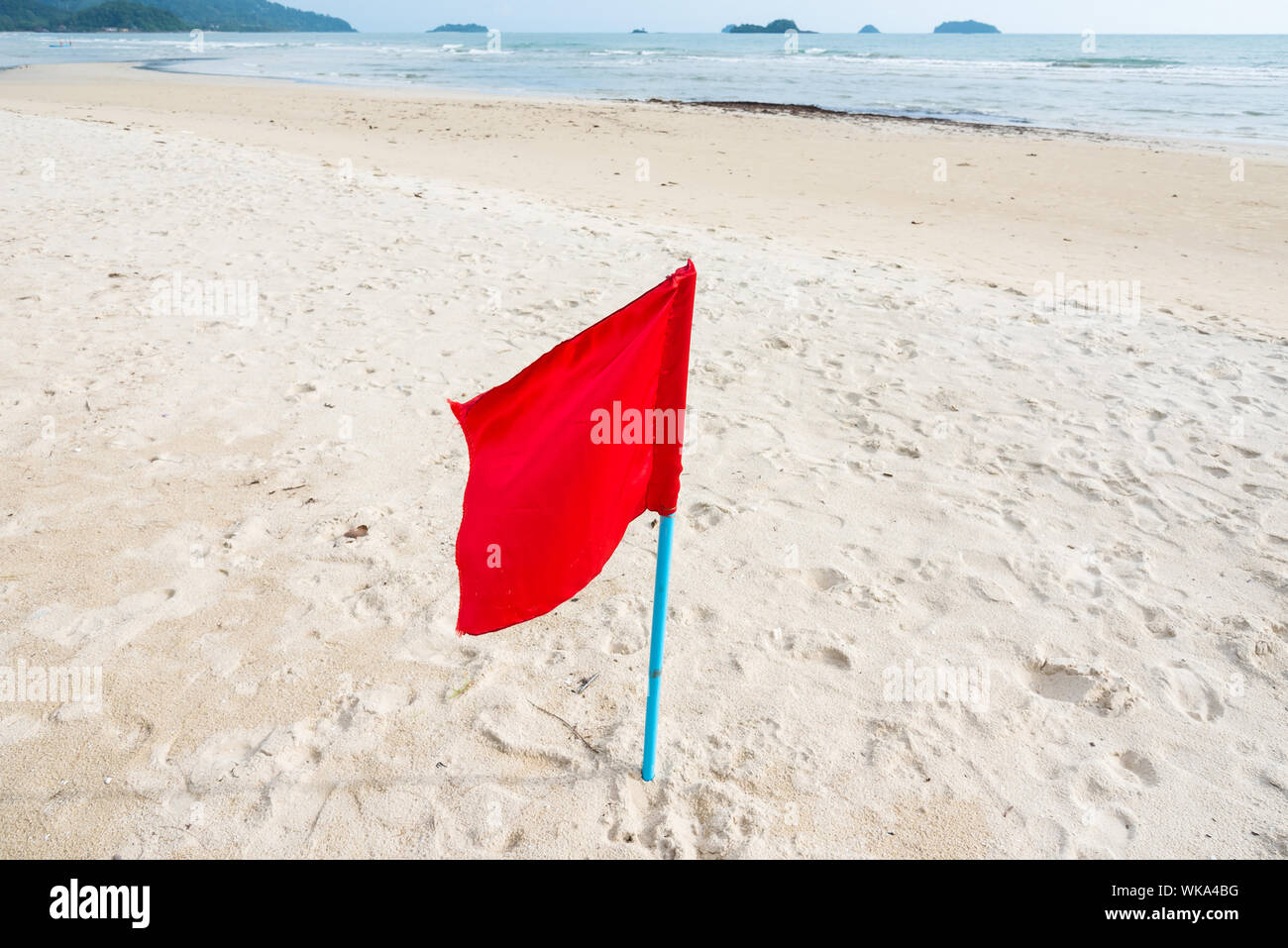 Red flag on beach hires stock photography and images Alamy