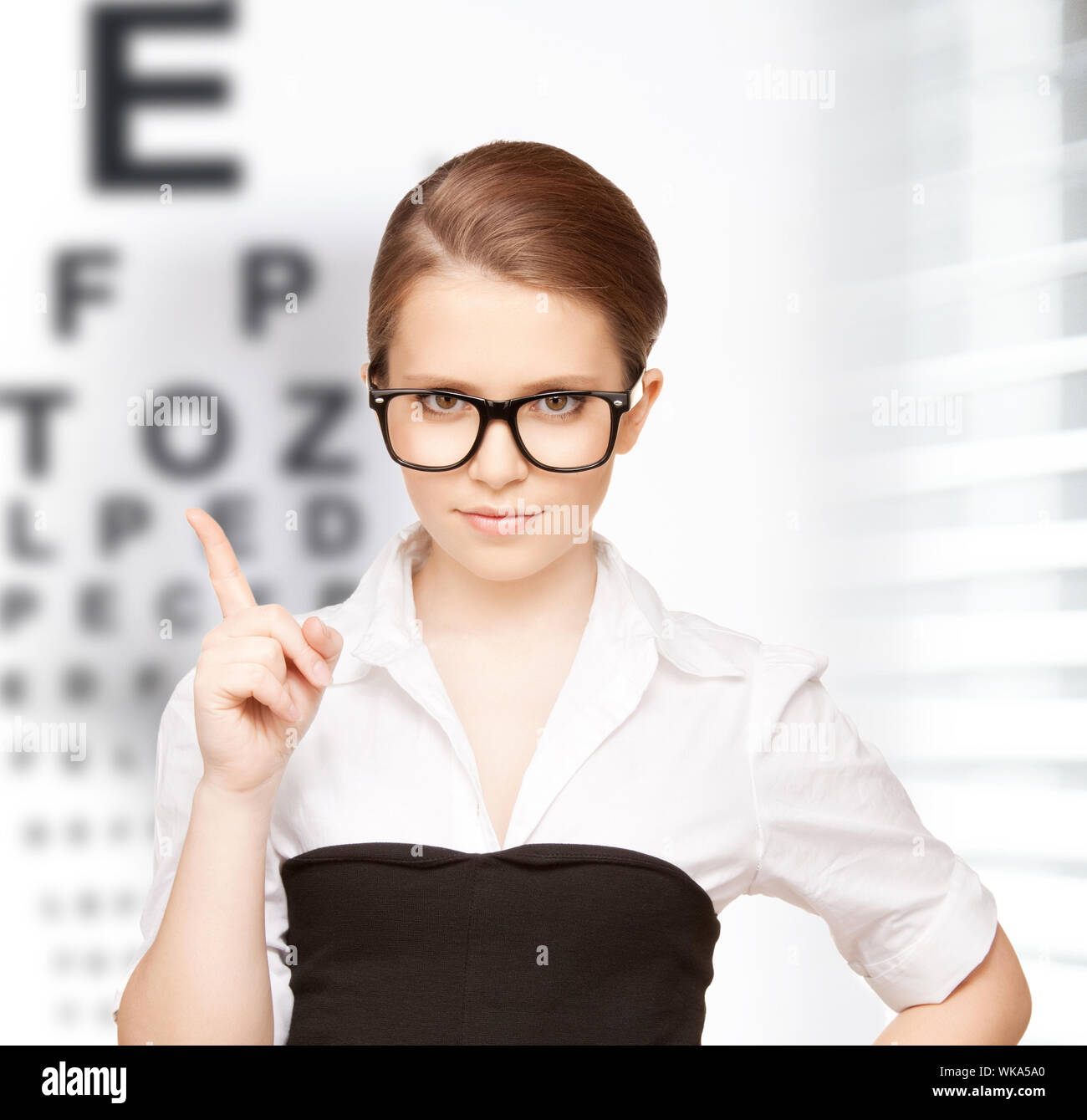 Woman eyes up finger hi-res stock photography and images - Alamy