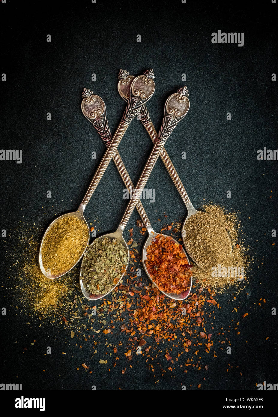 Close-up Of Seasoning In Spoons On Table Stock Photo