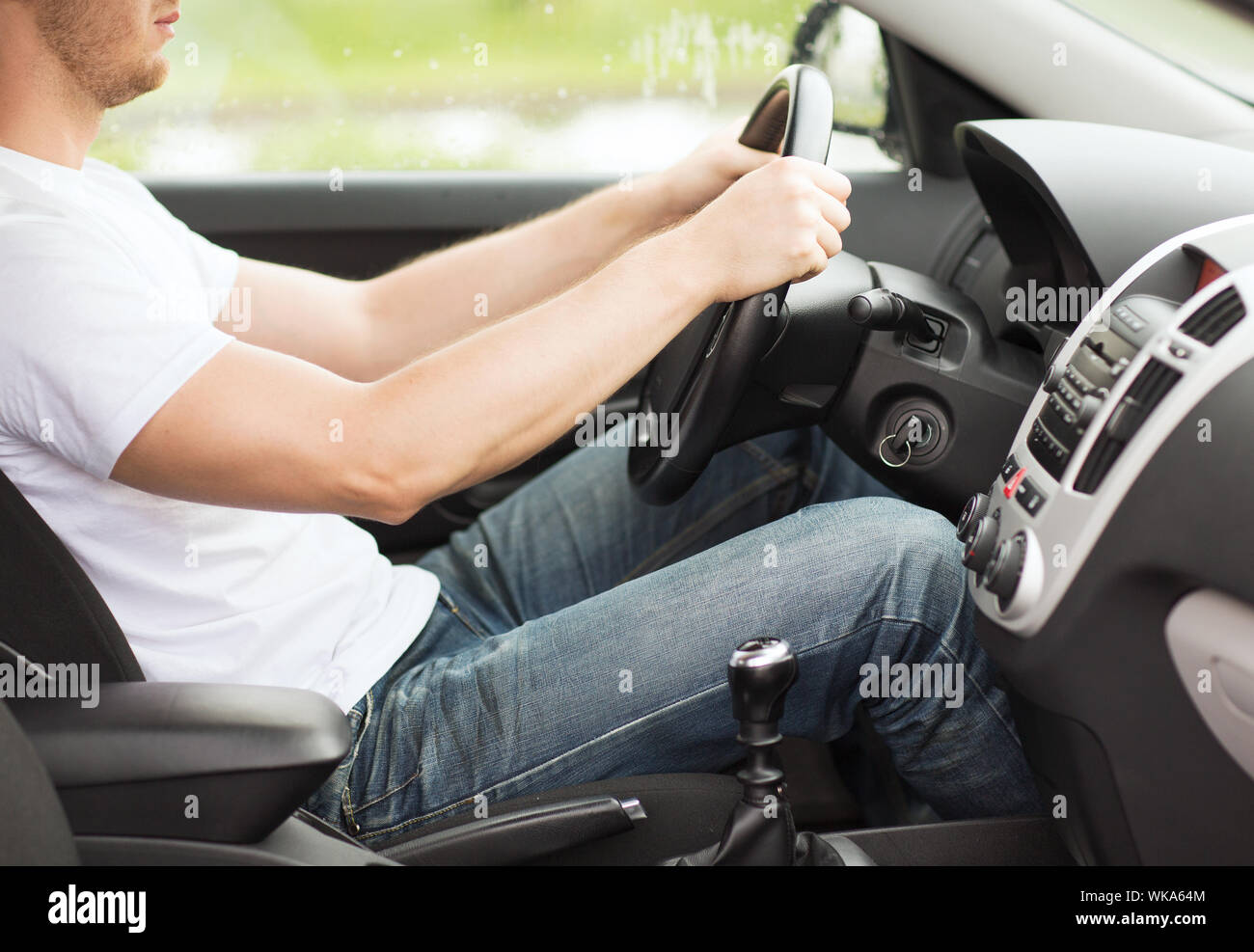 man driving the car with manual gearbox Stock Photo Alamy