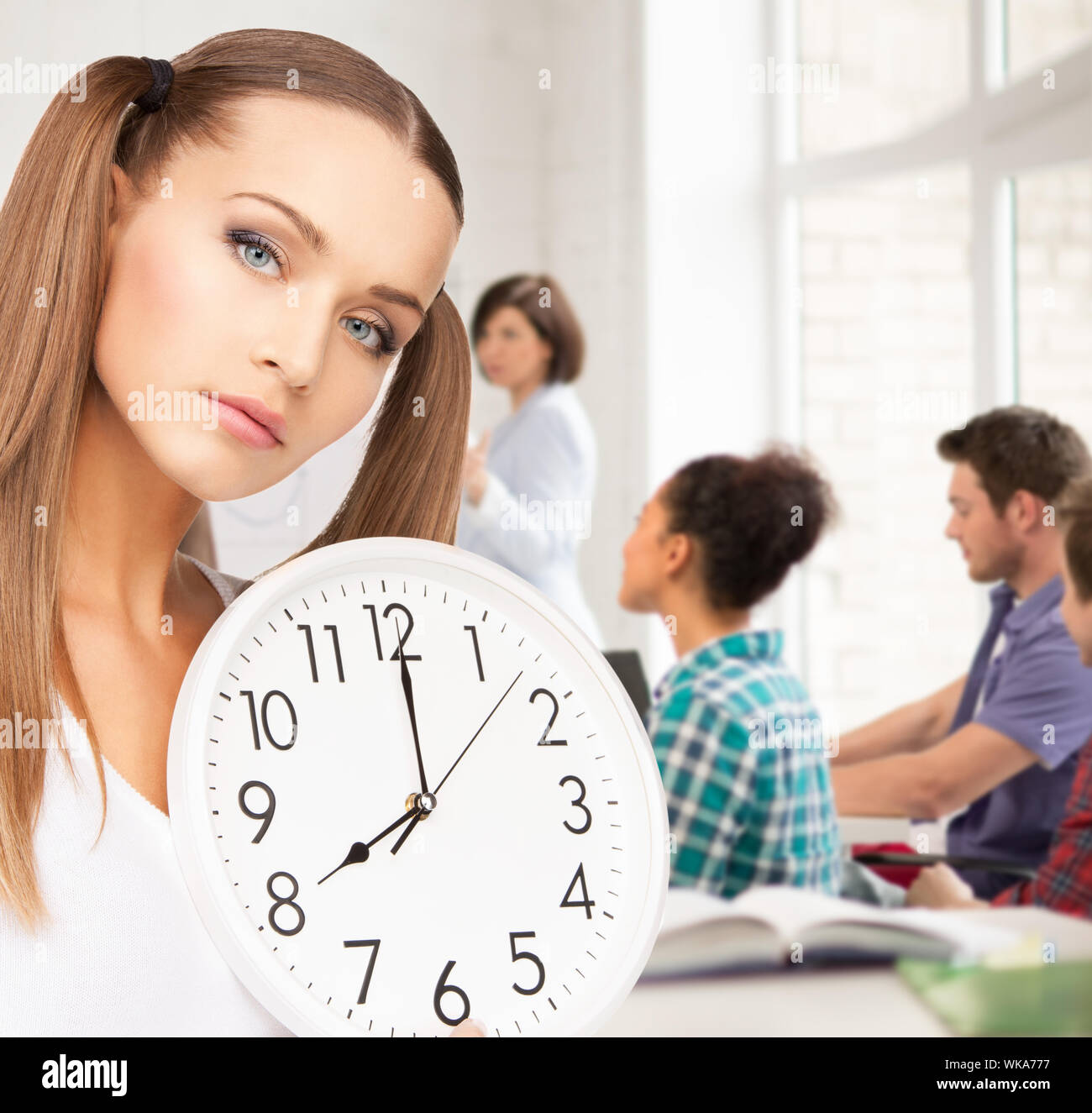 student showing clock Stock Photo Alamy