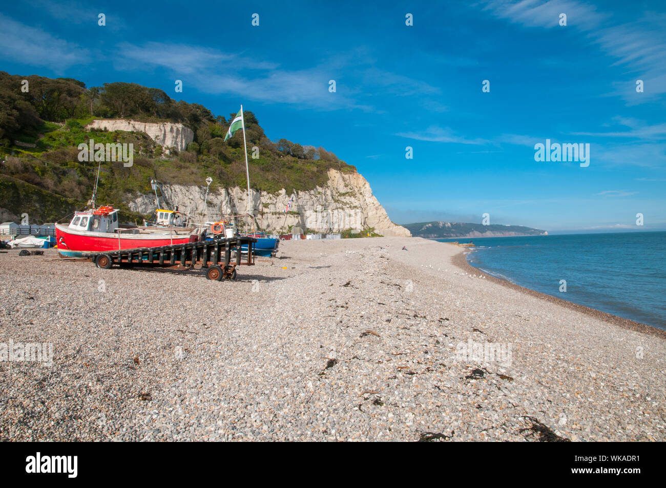 Fishing boats on the shore Beer Beach Devon England Stock Photo
