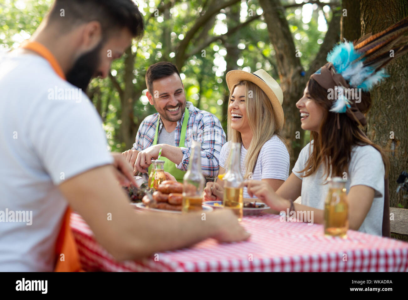 Group of friends having a barbecue party in nature Stock Photo - Alamy