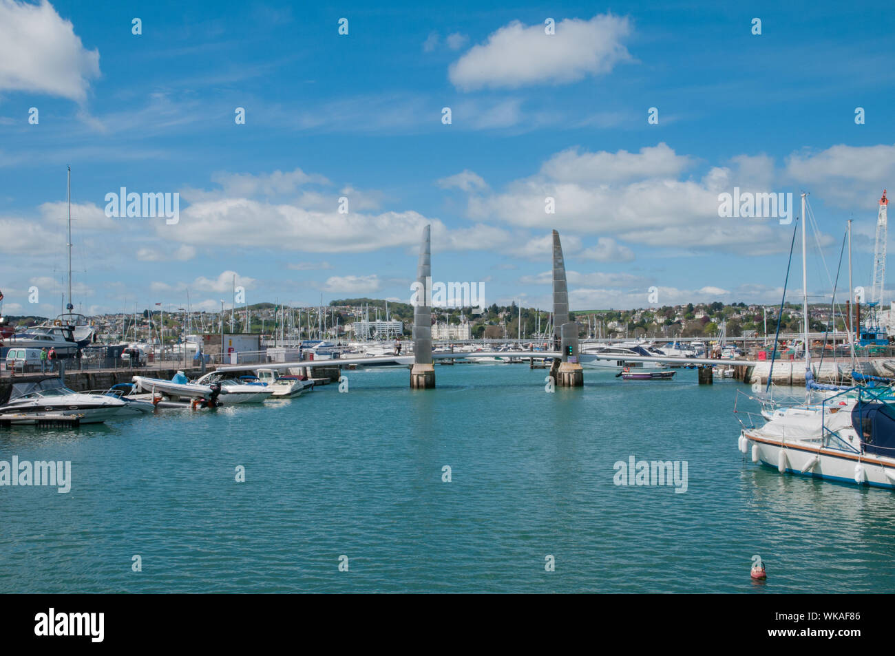 yachts and boats in Harbour Torquay Devon with Pedestrian Bridge England Stock Photo