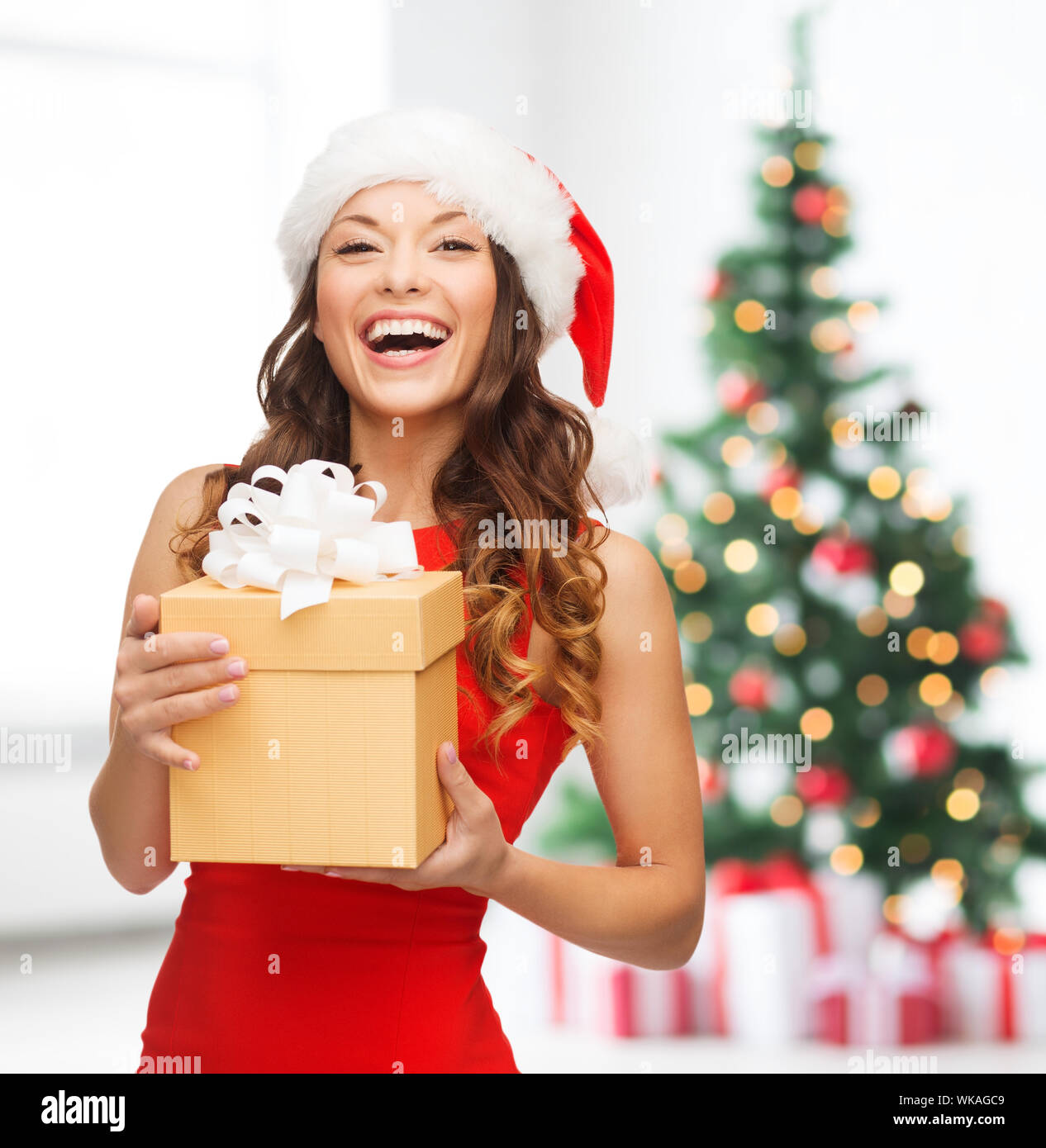christmas, x-mas, new year, winter, happiness concept - smiling woman ...