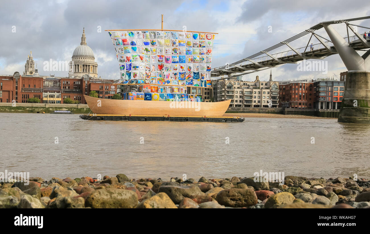 Westminster, London, 04th Sep 2019. Part of Totally Thames festival, the Ship of Tolerance is a beautiful 60-foot wooden boat installation on the River Thames at Tate Modern, with the artworks of children from around the world weaved together to create its sails. Promoting unity and encouraging tolerance, the ship becomes a beacon of acceptance and diversity. It was created by artists Ilya and Emilia Kabakov. Credit: Imageplotter/Alamy Live News Stock Photo