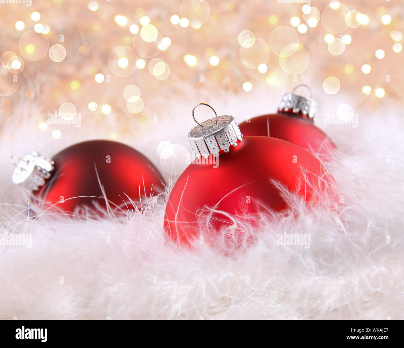 Red christmas balls with abstract light background Stock Photo - Alamy