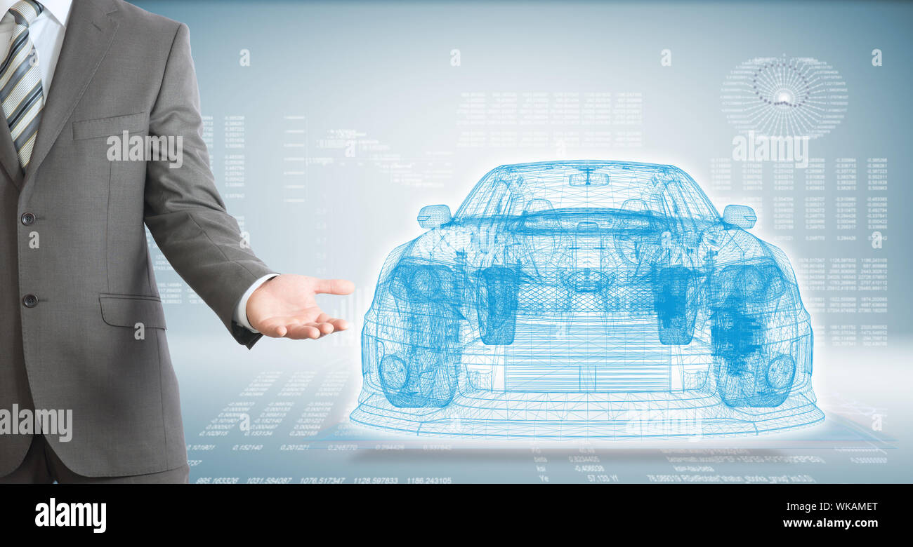 Businessman points hand on wire frame car. High-tech graphs at backdrop Stock Photo