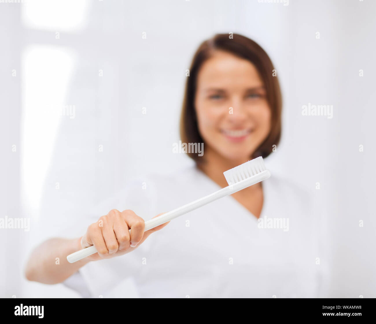 dentist with toothbrush in hospital Stock Photo Alamy