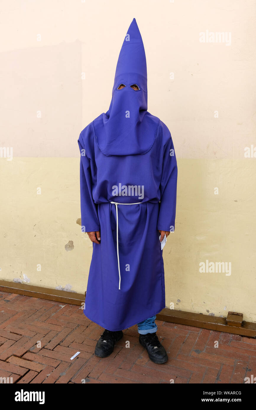 The cucuruchos of Ecuador walk the historic streets of Quito in their