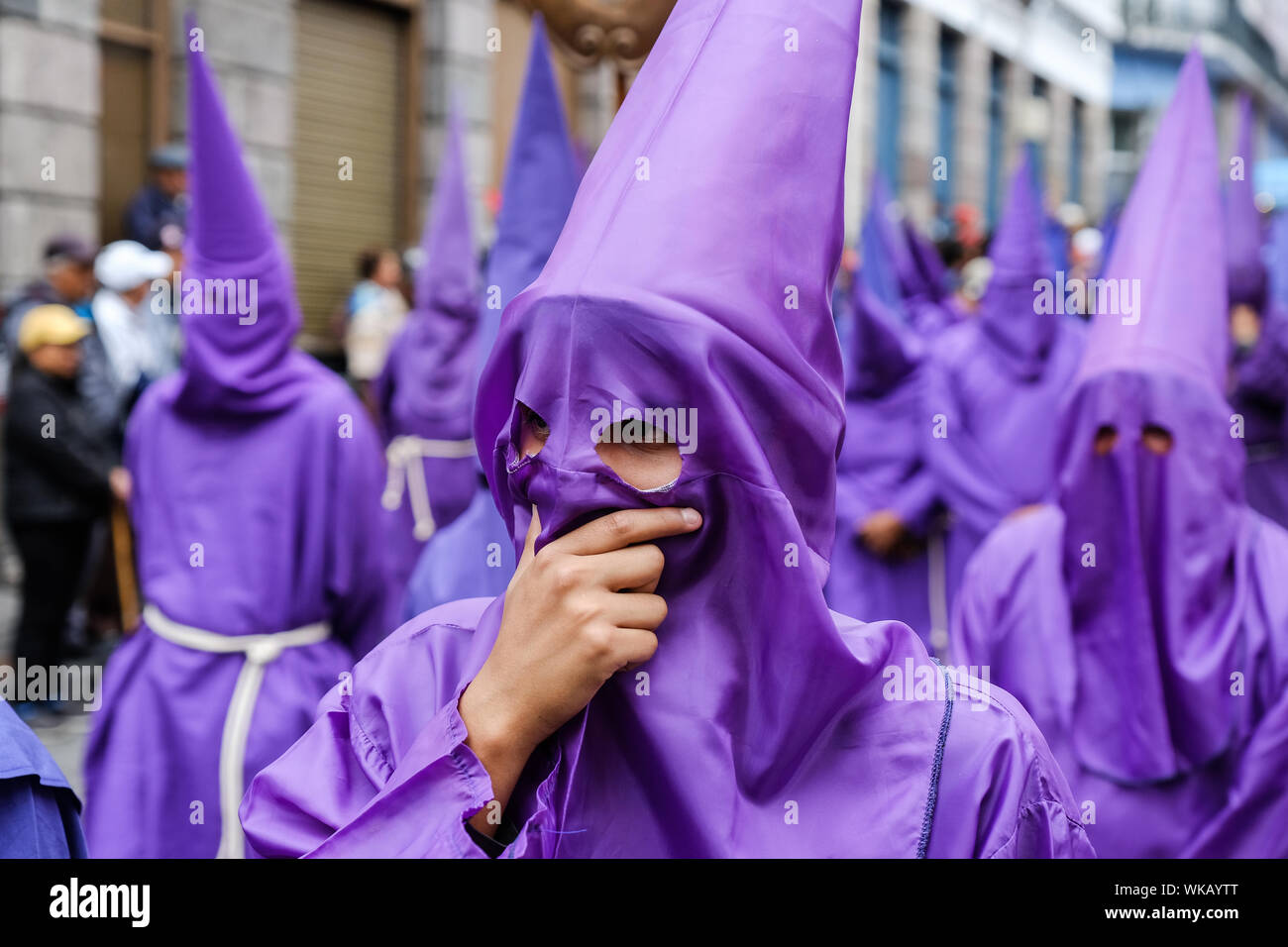The cucuruchos of Ecuador walk the historic streets of Quito in their