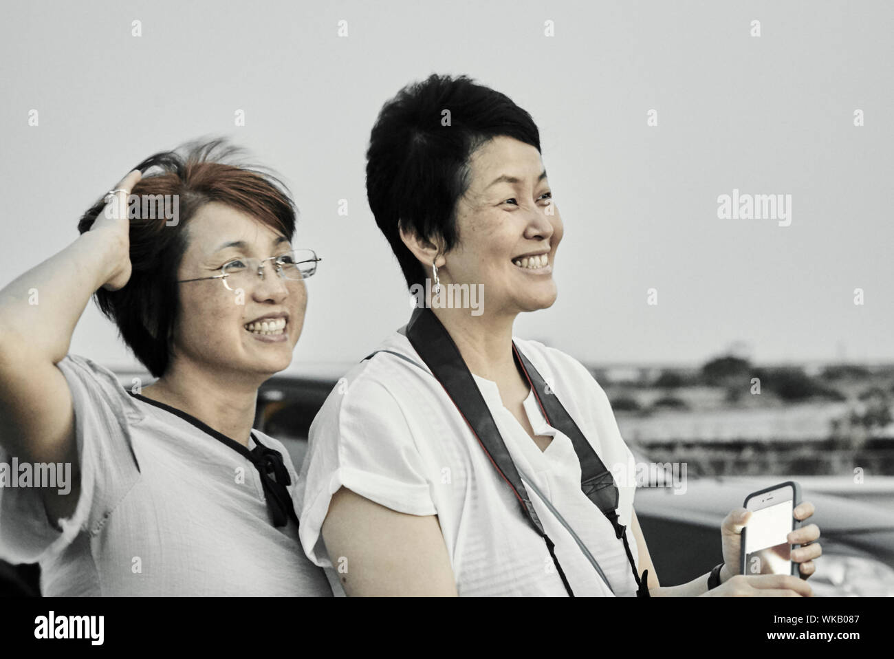 Close-up Of Smiling Mature Women At Beach Stock Photo