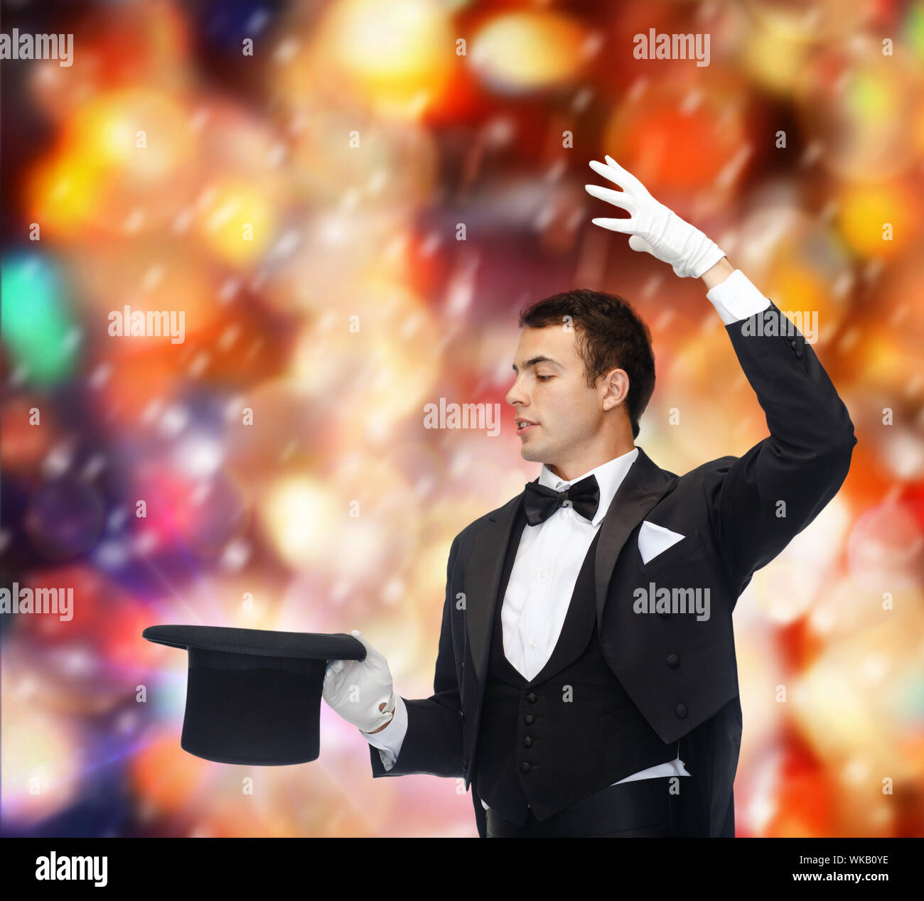 magician in top hat showing trick Stock Photo